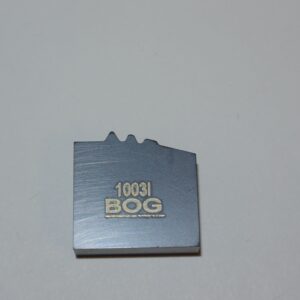 A metal object with the words " 1 0 6 3 i 8 0 g ".