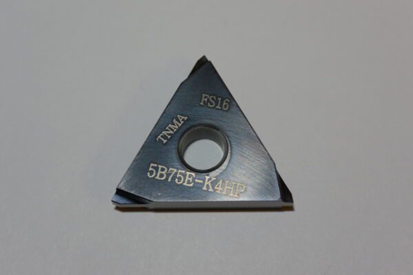 A triangle shaped cutter with the number 5 8 7 6 e-k 4 9 2