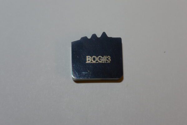 A close up of the bogies logo on a piece of metal.