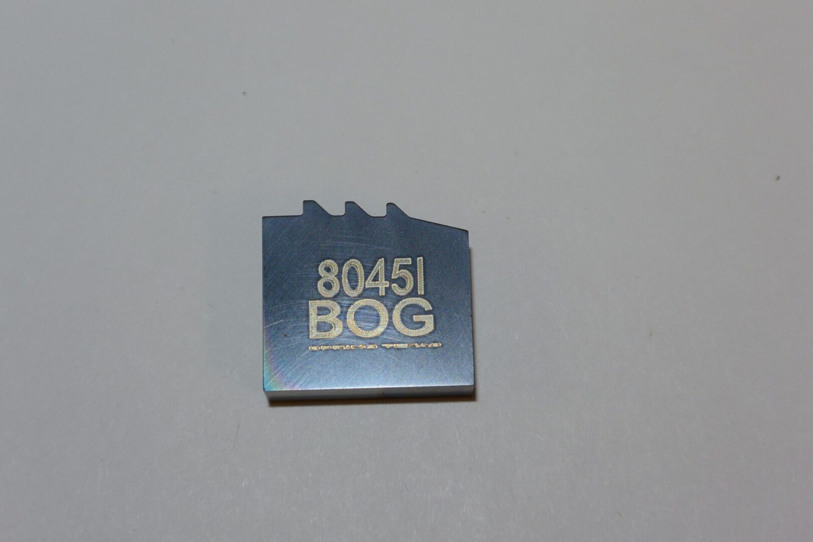 A blue and white sticker with the words " 8 0 4 5 1 " on it.