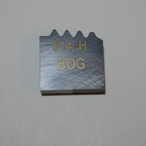 A metal block with the words " 8 4 h bog " written on it.